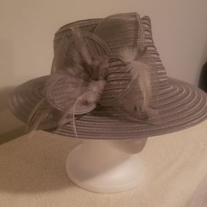 Lavender hat w/ feathers.